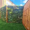 Bloom and Florian artificial living foliage panel on a fence