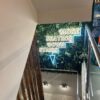 zen foliage wall with led sign of stairs