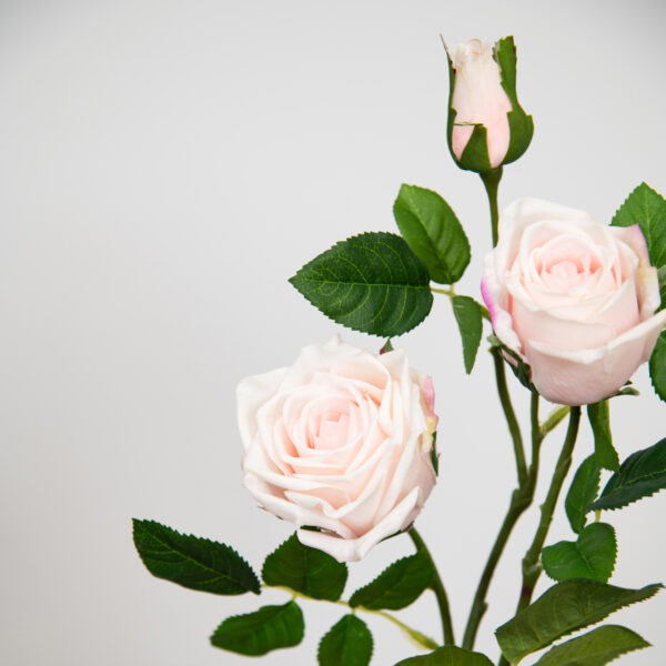 pale pink faux rose stem close