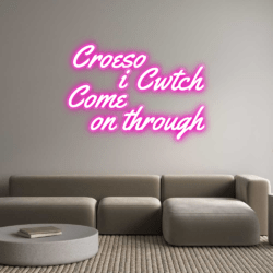 'Croeso i Cwtch/Come on through' neon sign