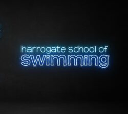 'Harrogate School of Swimming' neon sign